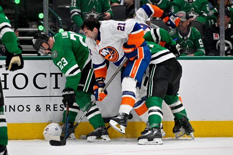 Oct 12, 2024; Dallas, Texas, USA; Dallas Stars defenseman Esa Lindell (23) knocks off the helmet of New York Islanders center Kyle Palmieri (21) during the third period at the American Airlines Center. Mandatory Credit: Jerome Miron-Imagn Images