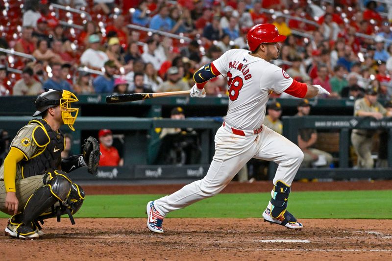 Aug 28, 2024; St. Louis, Missouri, USA;  St. Louis Cardinals third baseman Nolan Arenado (28) hits a one run walk-off single against the San Diego Padres during the ninth inning at Busch Stadium. Mandatory Credit: Jeff Curry-USA TODAY Sports