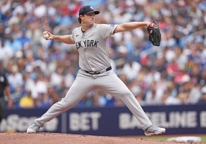 Jun 30, 2024; Toronto, Ontario, CAN; New York Yankees starting pitcher Gerrit Cole (45) throws a pitch against the Toronto Blue Jays during the first inning at Rogers Centre. Mandatory Credit: Nick Turchiaro-USA TODAY Sports