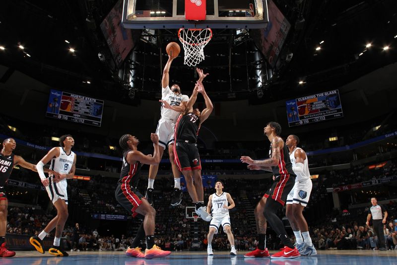 MEMPHIS, TN - OCTOBER 18: Maozinha Pereira #25 of the Memphis Grizzlies dunks the ball during the game against the Miami Heat during a NBA pre season game on October 18, 2024 at FedExForum in Memphis, Tennessee. NOTE TO USER: User expressly acknowledges and agrees that, by downloading and or using this photograph, User is consenting to the terms and conditions of the Getty Images License Agreement. Mandatory Copyright Notice: Copyright 2024 NBAE (Photo by Joe Murphy/NBAE via Getty Images)