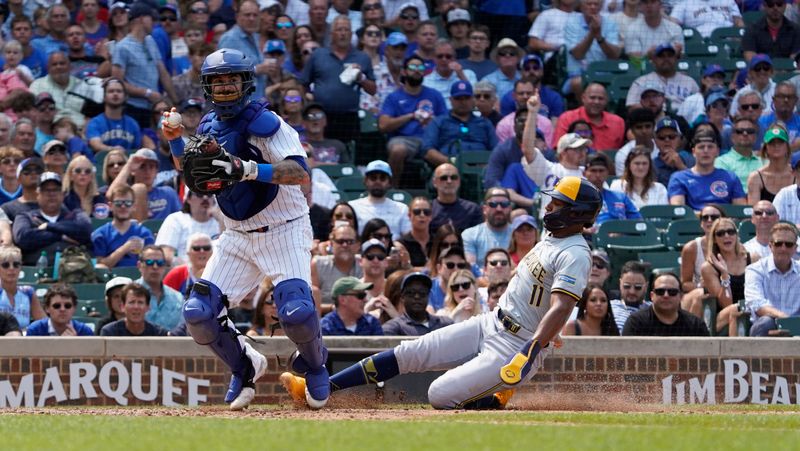 Jul 24, 2024; Chicago, Illinois, USA; Chicago Cubs catcher Tomss Nido (6) forces out Milwaukee Brewers outfielder Jackson Chourio (11) during the sixth inning at Wrigley Field. Mandatory Credit: David Banks-USA TODAY Sports