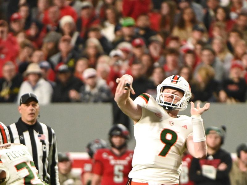 Nov 4, 2023; Raleigh, North Carolina, USA; Miami Hurricanes quarterback Tyler Van Dyke (9) throws a pass during the first half against the North Carolina State Wolfpack at Carter-Finley Stadium. Mandatory Credit: Rob Kinnan-USA TODAY Sports