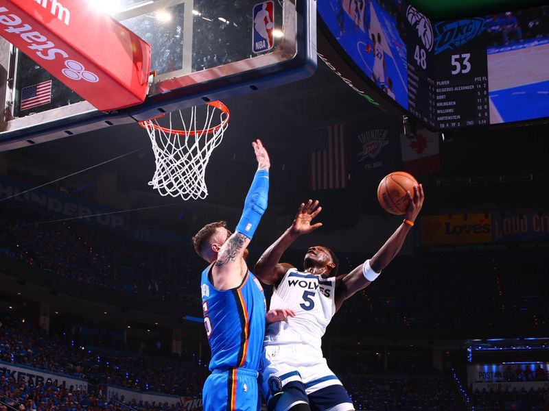 OKLAHOMA CITY, OK - MAY 22: Anthony Edwards #5 of the Minnesota Timberwolves drives to the basket during the game against the Oklahoma City Thunder during Game Two of the Western Conference Finals on May 22, 2025 at Paycom Center in Oklahoma City, Oklahoma. NOTE TO USER: User expressly acknowledges and agrees that, by downloading and or using this photograph, User is consenting to the terms and conditions of the Getty Images License Agreement. Mandatory Copyright Notice: Copyright 2025 NBAE (Photo by Zach Beeker/NBAE via Getty Images)