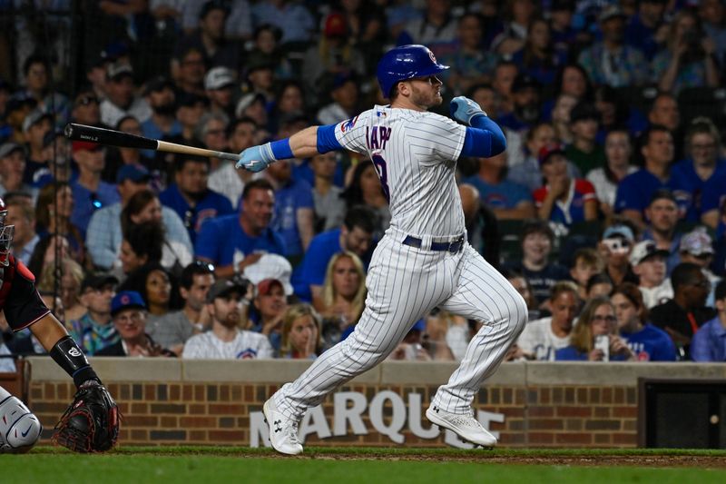 Jul 17, 2023; Chicago, Illinois, USA;  Chicago Cubs left fielder Ian Happ (8) hits a two-run home run against the Washington Nationals during the sixth inning at Wrigley Field. Mandatory Credit: Matt Marton-USA TODAY Sports