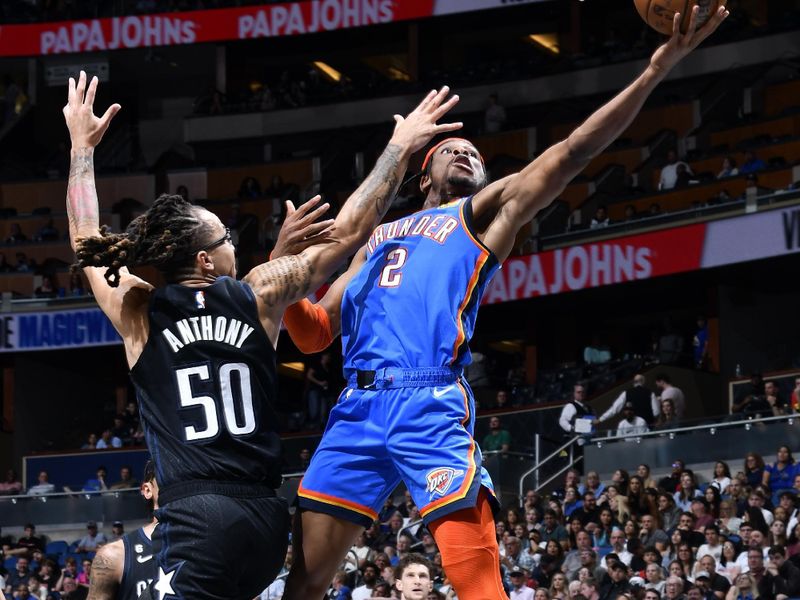 ORLANDO, FL - JANUARY 4:  Shai Gilgeous-Alexander #2 of the Oklahoma City Thunder goes to the basket against the Orlando Magic on January 4, 2023 at Amway Center in Orlando, Florida. NOTE TO USER: User expressly acknowledges and agrees that, by downloading and or using this photograph, User is consenting to the terms and conditions of the Getty Images License Agreement. Mandatory Copyright Notice: Copyright 2023 NBAE (Photo by Gary Bassing/NBAE via Getty Images)