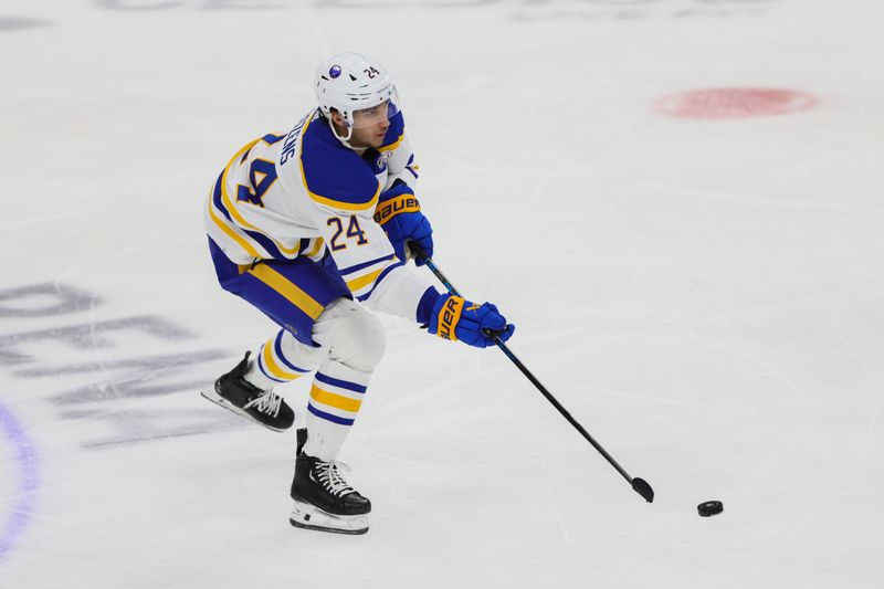 Apr 13, 2024; Sunrise, Florida, USA; Buffalo Sabres center Dylan Cozens (24) move the puck against the Florida Panthers during the third period at Amerant Bank Arena. Mandatory Credit: Sam Navarro-USA TODAY Sports