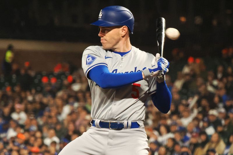 May 14, 2024; San Francisco, California, USA; Los Angeles Dodgers first baseman Freddie Freeman (5) avoids a high pitch against the San Francisco Giants during the ninth inning at Oracle Park. Mandatory Credit: Kelley L Cox-USA TODAY Sports