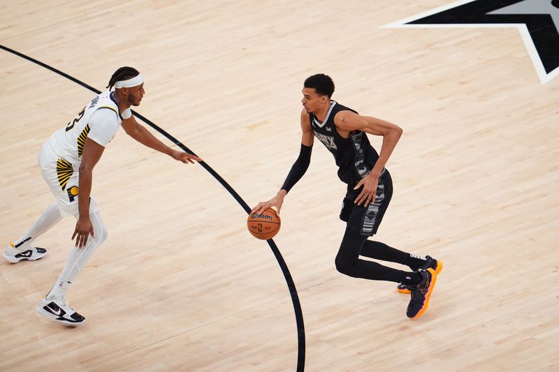 SAN ANTONIO, TX - MARCH 3: Victor Wembanyama #1 of the San Antonio Spurs dribbles the ball during the game against the Indiana Pacers on March 3, 2024 at the AT&T Center in San Antonio, Texas. NOTE TO USER: User expressly acknowledges and agrees that, by downloading and or using this photograph, user is consenting to the terms and conditions of the Getty Images License Agreement. Mandatory Copyright Notice: Copyright 2024 NBAE (Photos by Cooper Neill/NBAE via Getty Images)