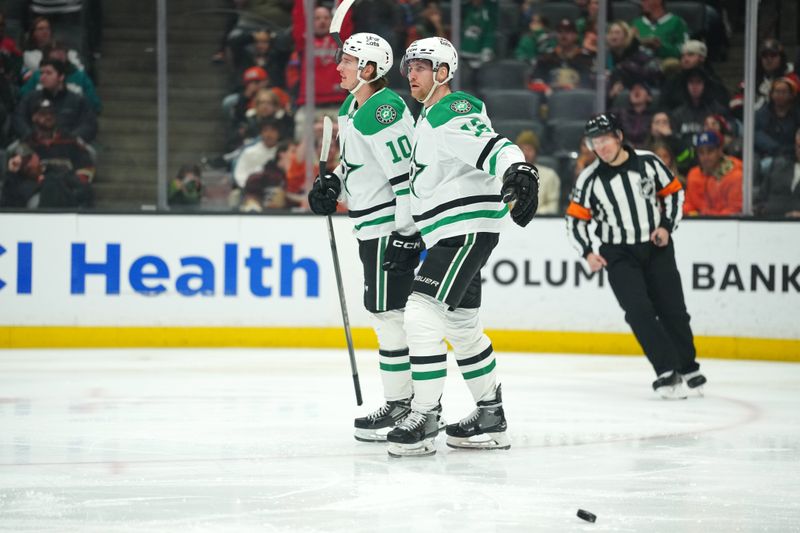 Dec 19, 2025; Anaheim, California, USA; Dallas Stars center Oskar Bäck (10) and center Radek Faksa (12) celebrate after a goal against the Anaheim Ducks in the first period at Honda Center. Mandatory Credit: Kirby Lee-Imagn Images