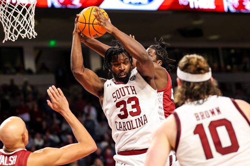 Feb 4, 2023; Columbia, South Carolina, USA; South Carolina Gamecocks forward Josh Gray (33) grabs a rebound against the Arkansas Razorbacks in the second half at Colonial Life Arena. Mandatory Credit: Jeff Blake-USA TODAY Sports