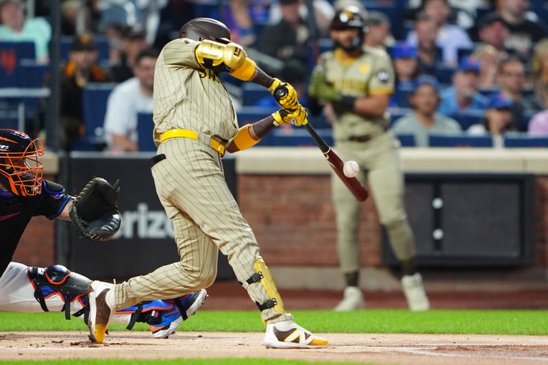 Jun 14, 2024; New York City, New York, USA;  San Diego Padres first baseman Luis Arraez (4) hits a single against the New York Mets during the first inning at Citi Field. Mandatory Credit: Gregory Fisher-USA TODAY Sports