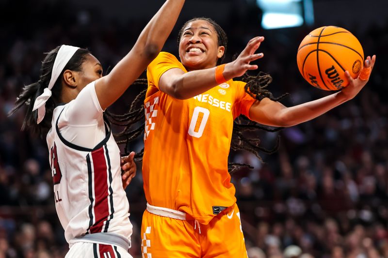 Mar 3, 2024; Columbia, South Carolina, USA; Tennessee Lady Vols guard Jewel Spear (0) shoots over South Carolina Gamecocks guard Bree Hall (23) in the second half at Colonial Life Arena. Mandatory Credit: Jeff Blake-USA TODAY Sports