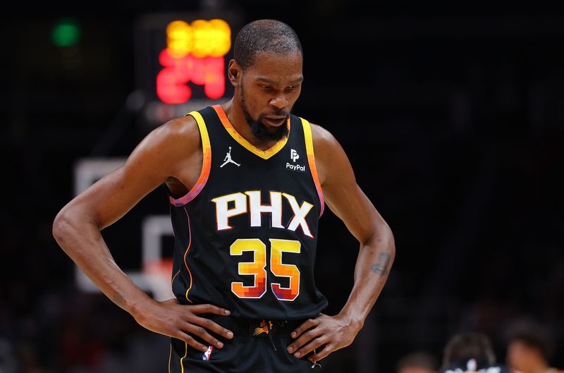 ATLANTA, GEORGIA - FEBRUARY 02:  Kevin Durant #35 of the Phoenix Suns reacts against the Atlanta Hawks during the third quarter at State Farm Arena on February 02, 2024 in Atlanta, Georgia.  NOTE TO USER: User expressly acknowledges and agrees that, by downloading and/or using this photograph, user is consenting to the terms and conditions of the Getty Images License Agreement.  (Photo by Kevin C. Cox/Getty Images)