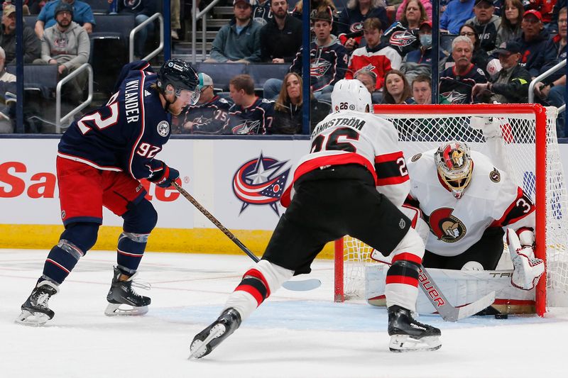 Mar 14, 2024; Columbus, Ohio, USA; Ottawa Senators goalie Anton Forsberg (31) makes a save as Columbus Blue Jackets left wing Alexander Nylander (92) looks for a rebound during the third period at Nationwide Arena. Mandatory Credit: Russell LaBounty-USA TODAY Sports