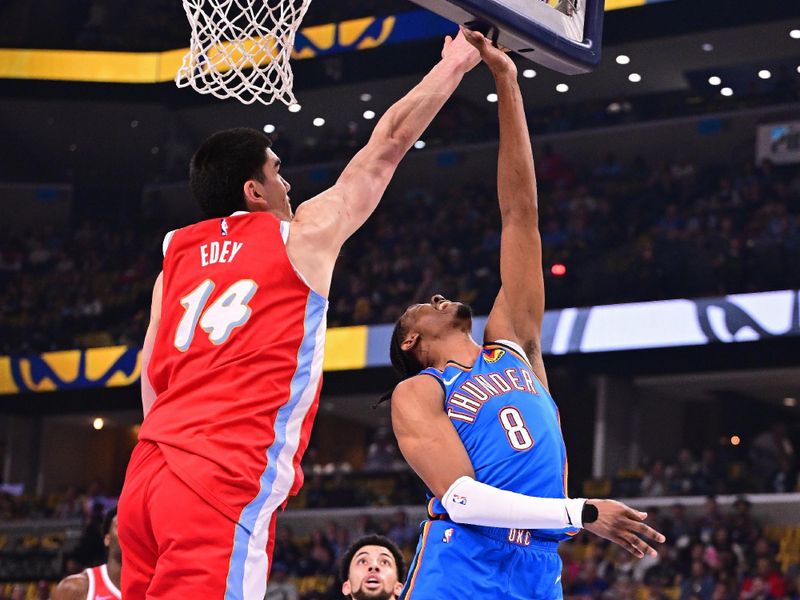 MEMPHIS, TN - APRIL 26: Zach Edey #14 of the Memphis Grizzlies block during the game against the Oklahoma City Thunder during Round 1 Game 4 of the 2025 NBA Playoffs on April 26, 2025 at FedExForum in Memphis, Tennessee. NOTE TO USER: User expressly acknowledges and agrees that, by downloading and or using this photograph, User is consenting to the terms and conditions of the Getty Images License Agreement. Mandatory Copyright Notice: Copyright 2025 NBAE(Photo by Adam Hagy/NBAE via Getty Images)