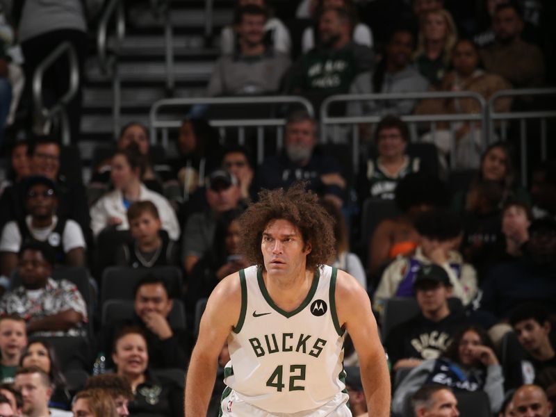 MILWAUKEE, WI - OCTOBER 20: Robin Lopez #42 of the Milwaukee Bucks plays defense during the preseason game on October 20, 2023 at the Fiserv Forum Center in Milwaukee, Wisconsin. NOTE TO USER: User expressly acknowledges and agrees that, by downloading and or using this Photograph, user is consenting to the terms and conditions of the Getty Images License Agreement. Mandatory Copyright Notice: Copyright 2023 NBAE (Photo by Gary Dineen/NBAE via Getty Images).