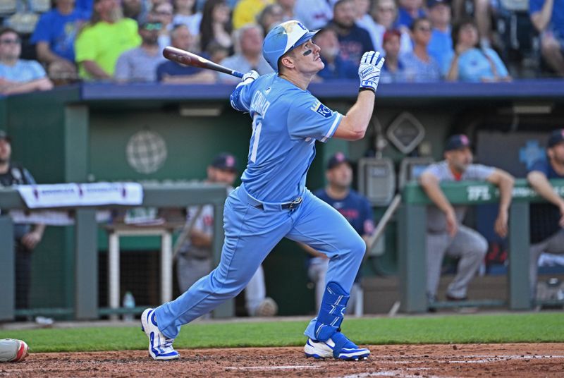 May 10, 2025; Kansas City, Missouri, USA;  Kansas City Royals left fielder Mark Canha (21) hits an RBI single in the third inning agaisnt the Boston Red Sox at Kauffman Stadium. Mandatory Credit: Peter Aiken-Imagn Images