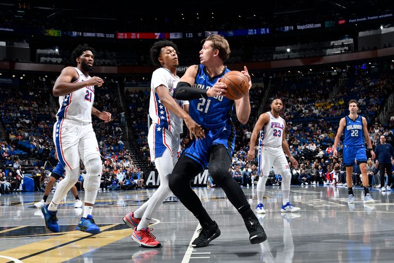 ORLANDO, FL - NOVEMBER 15: Moritz Wagner #21 of the Orlando Magic looks to pass the ball during the game against the Philadelphia 76ers during the Emirates NBA Cup game on  November 15, 2024 at Kia Center in Orlando, Florida. NOTE TO USER: User expressly acknowledges and agrees that, by downloading and or using this photograph, User is consenting to the terms and conditions of the Getty Images License Agreement. Mandatory Copyright Notice: Copyright 2024 NBAE (Photo by Fernando Medina/NBAE via Getty Images)