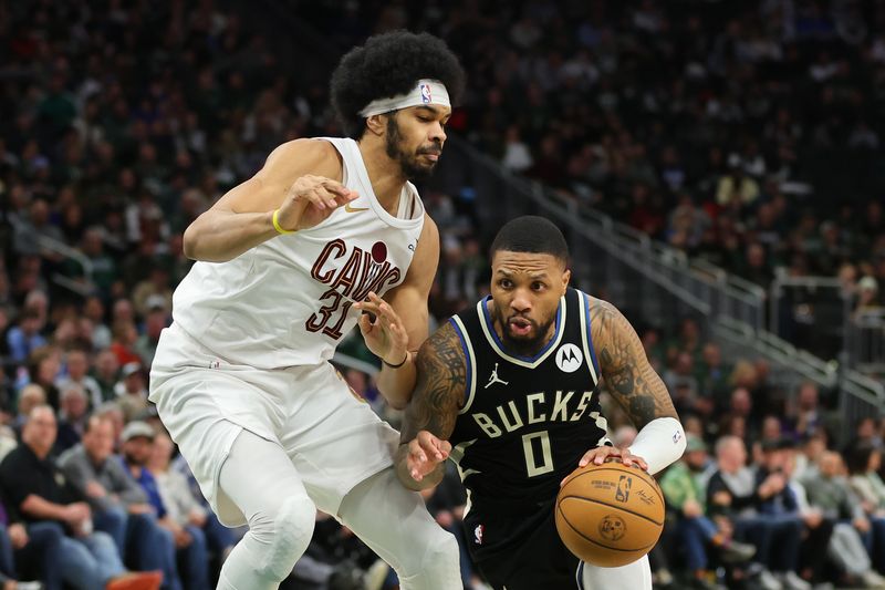 MILWAUKEE, WISCONSIN - JANUARY 26: Damian Lillard #0 of the Milwaukee Bucks is defended by Jarrett Allen #31 of the Cleveland Cavaliers during a game at Fiserv Forum on January 26, 2024 in Milwaukee, Wisconsin. NOTE TO USER: User expressly acknowledges and agrees that, by downloading and or using this photograph, User is consenting to the terms and conditions of the Getty Images License Agreement. (Photo by Stacy Revere/Getty Images)