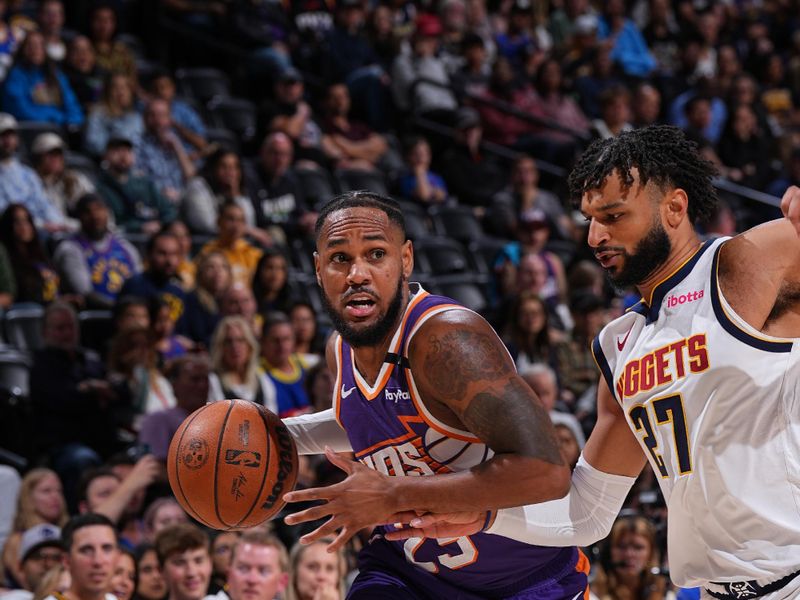 DENVER, CO - OCTOBER 13: Monte Morris #23 of the Phoenix Suns drives to the basket during the game against the Denver Nuggets on October 13, 2024 at Ball Arena in Denver, Colorado. NOTE TO USER: User expressly acknowledges and agrees that, by downloading and/or using this Photograph, user is consenting to the terms and conditions of the Getty Images License Agreement. Mandatory Copyright Notice: Copyright 2024 NBAE (Photo by Garrett Ellwood/NBAE via Getty Images)