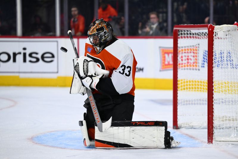 Oct 26, 2024; Philadelphia, Pennsylvania, USA; Philadelphia Flyers goalie Samuel Ersson (33) makes a save against the Minnesota Wild in the second period at Wells Fargo Center. Mandatory Credit: Kyle Ross-Imagn Images