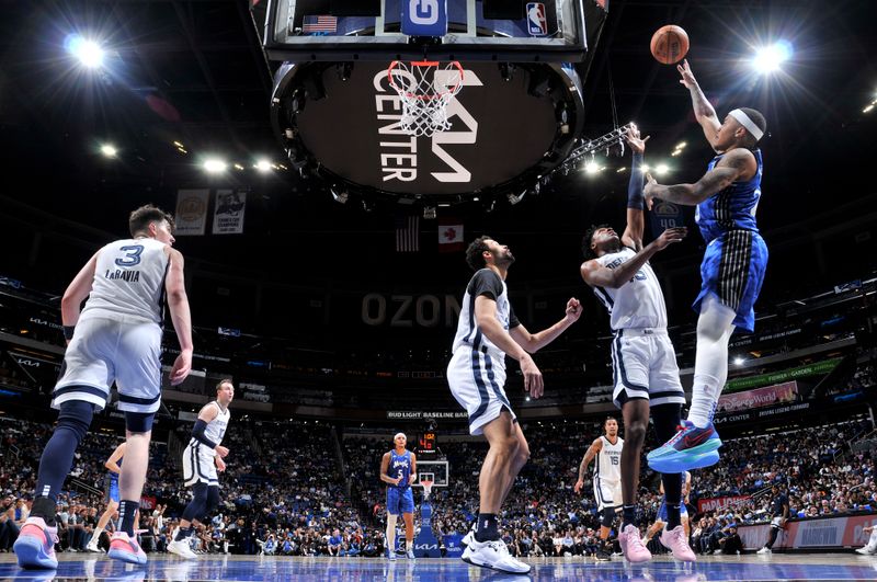 ORLANDO, FL - MARCH 30: Markelle Fultz #20 of the Orlando Magic shoots the ball during the game against the Memphis Grizzlies on March 30, 2024 at the Kia Center in Orlando, Florida. NOTE TO USER: User expressly acknowledges and agrees that, by downloading and or using this photograph, User is consenting to the terms and conditions of the Getty Images License Agreement. Mandatory Copyright Notice: Copyright 2024 NBAE (Photo by Fernando Medina/NBAE via Getty Images)