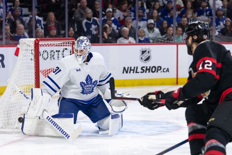 Feb 10, 2024; Ottawa, Ontario, CAN; Toronto Maple Leafs goalie Martin Jones (31) makes a save on a shot from Ottawa Senators center Mark Kastelic (12) in the first period at the Canadian Tire Centre. Mandatory Credit: Marc DesRosiers-USA TODAY Sports