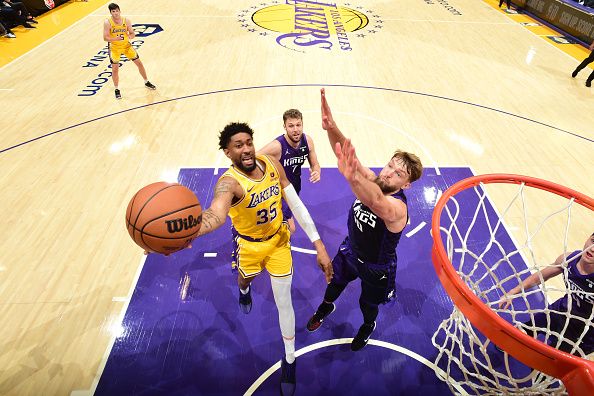 LOS ANGELES, CA - NOVEMBER 15: Christian Wood #35 of the Los Angeles Lakers drives to the basket during the game against the Sacramento Kings on November 15, 2023 at Crypto.Com Arena in Los Angeles, California. NOTE TO USER: User expressly acknowledges and agrees that, by downloading and/or using this Photograph, user is consenting to the terms and conditions of the Getty Images License Agreement. Mandatory Copyright Notice: Copyright 2023 NBAE (Photo by Adam Pantozzi/NBAE via Getty Images)