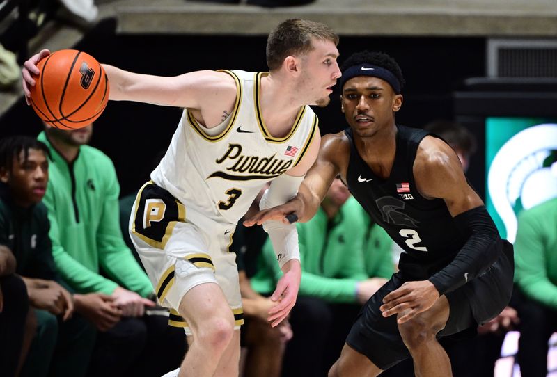 Mar 2, 2024; West Lafayette, Indiana, USA; Purdue Boilermakers guard Braden Smith (3) looks for a way around Michigan State Spartans guard Tyson Walker (2) during the first half at Mackey Arena. Mandatory Credit: Marc Lebryk-USA TODAY Sports