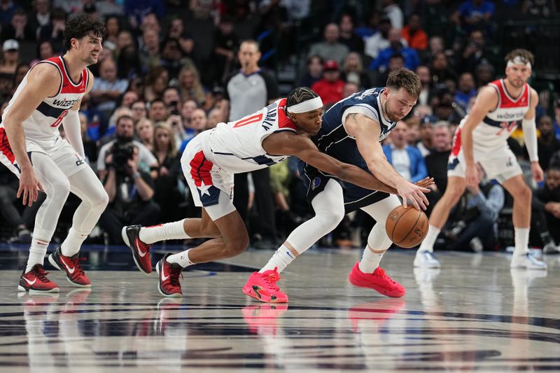 DALLAS, TX - FEBRUARY 12: Bilal Coulibaly #0 of the Washington Wizards and Luka Doncic #77 of the Dallas Mavericks reach for the ball on February 12, 2024 at the American Airlines Center in Dallas, Texas. NOTE TO USER: User expressly acknowledges and agrees that, by downloading and or using this photograph, User is consenting to the terms and conditions of the Getty Images License Agreement. Mandatory Copyright Notice: Copyright 2024 NBAE (Photo by Glenn James/NBAE via Getty Images)