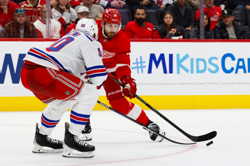 Oct 17, 2024; Detroit, Michigan, USA;  Detroit Red Wings center Tyler Motte (14) skates with the puck defended by New York Rangers defenseman Victor Mancini (90) in the second period at Little Caesars Arena. Mandatory Credit: Rick Osentoski-Imagn Images