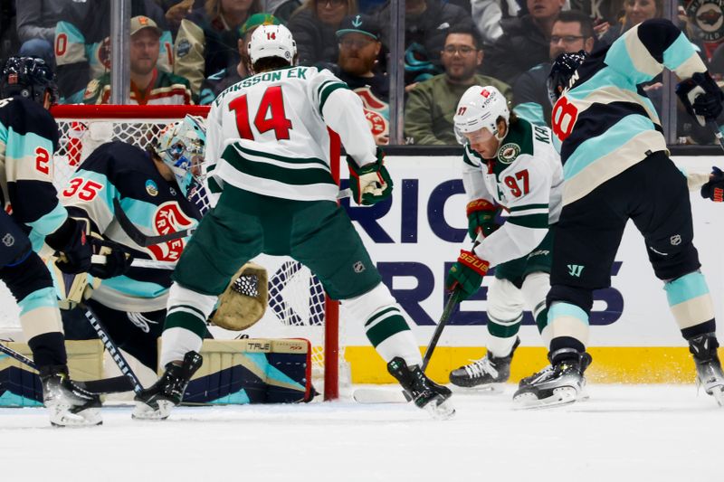 Feb 24, 2024; Seattle, Washington, USA; Minnesota Wild left wing Kirill Kaprizov (97) scores a goal against Seattle Kraken goaltender Joey Daccord (35) during the first period at Climate Pledge Arena. Mandatory Credit: Joe Nicholson-USA TODAY Sports