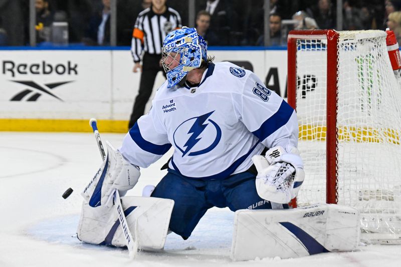 Apr 7, 2025; New York, New York, USA;  Tampa Bay Lightning goaltender Andrei Vasilevskiy (88) makes a save against the New York Rangers during the second period at Madison Square Garden. Mandatory Credit: Dennis Schneidler-Imagn Images