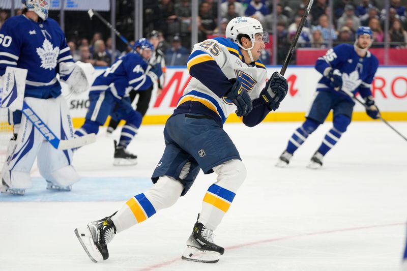 Oct 24, 2024; Toronto, Ontario, CAN; St. Louis Blues forward Jordan Kyrou (25) skates against the Toronto Maple Leafs during the second period at Scotiabank Arena. Mandatory Credit: John E. Sokolowski-Imagn Images