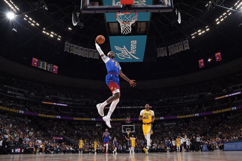 DENVER, CO - OCTOBER 24: Kentavious Caldwell-Pope #5 of the Denver Nuggets dunks the ball against the Los Angeles Lakers on October 24, 2023 at the Ball Arena in Denver, Colorado. NOTE TO USER: User expressly acknowledges and agrees that, by downloading and/or using this Photograph, user is consenting to the terms and conditions of the Getty Images License Agreement. Mandatory Copyright Notice: Copyright 2023 NBAE (Photo by Garrett Ellwood/NBAE via Getty Images)