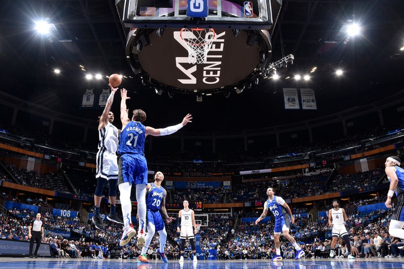 ORLANDO, FL - MARCH 30: Brandon Clarke #15 of the Memphis Grizzlies shoots the ball during the game against the Orlando Magic on March 30, 2024 at the Kia Center in Orlando, Florida. NOTE TO USER: User expressly acknowledges and agrees that, by downloading and or using this photograph, User is consenting to the terms and conditions of the Getty Images License Agreement. Mandatory Copyright Notice: Copyright 2024 NBAE (Photo by Fernando Medina/NBAE via Getty Images)