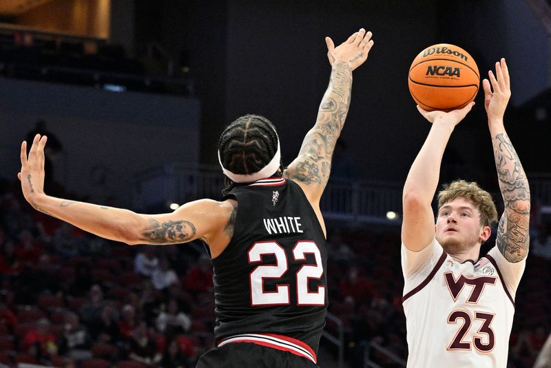 Mar 5, 2024; Louisville, Kentucky, USA; Virginia Tech Hokies guard Tyler Nickel (23) shoots against Louisville Cardinals guard Tre White (22) during the first half at KFC Yum! Center. Mandatory Credit: Jamie Rhodes-USA TODAY Sports