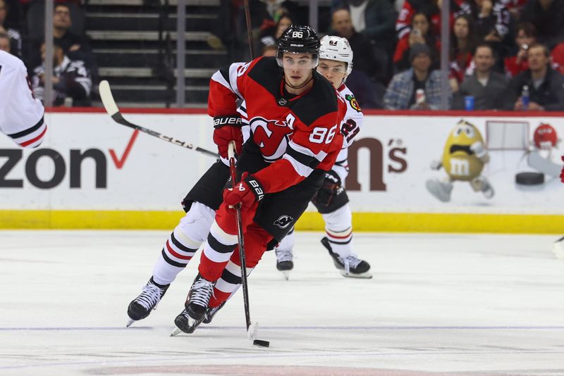 Jan 5, 2024; Newark, New Jersey, USA; New Jersey Devils center Jack Hughes (86) skates with the puck against the Chicago Blackhawks during the second period at Prudential Center. Mandatory Credit: Ed Mulholland-USA TODAY Sports