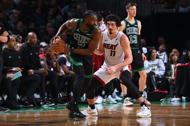 BOSTON, MA - DECEMBER 2: Jaylen Brown #7 of the Boston Celtics handles the ball defended by Jaime Jaquez Jr. #11 of the Miami Heat during the game on December 2, 2024 at TD Garden in Boston, Massachusetts. NOTE TO USER: User expressly acknowledges and agrees that, by downloading and/or using this Photograph, user is consenting to the terms and conditions of the Getty Images License Agreement. Mandatory Copyright Notice: Copyright 2024 NBAE (Photo by Brian Babineau/NBAE via Getty Images)