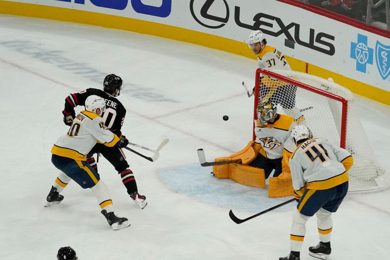 Nov 28, 2025; Chicago, Illinois, USA; Chicago Blackhawks center Ryan Greene (20) scores a goal on Nashville Predators goaltender Juuse Saros (74) during the second period at United Center. Mandatory Credit: David Banks-Imagn Images