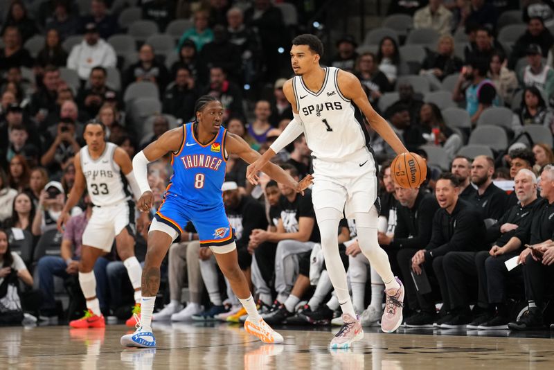 SAN ANTONIO, TX - FEBRUARY 29: Jalen Williams #8 of the Oklahoma City Thunder plays defense against Victor Wembanyama #1 of the San Antonio Spurs on February 29, 2024 at the Frost Bank Center in San Antonio, Texas. NOTE TO USER: User expressly acknowledges and agrees that, by downloading and or using this photograph, user is consenting to the terms and conditions of the Getty Images License Agreement. Mandatory Copyright Notice: Copyright 2024 NBAE (Photos by Darren Carroll/NBAE via Getty Images)