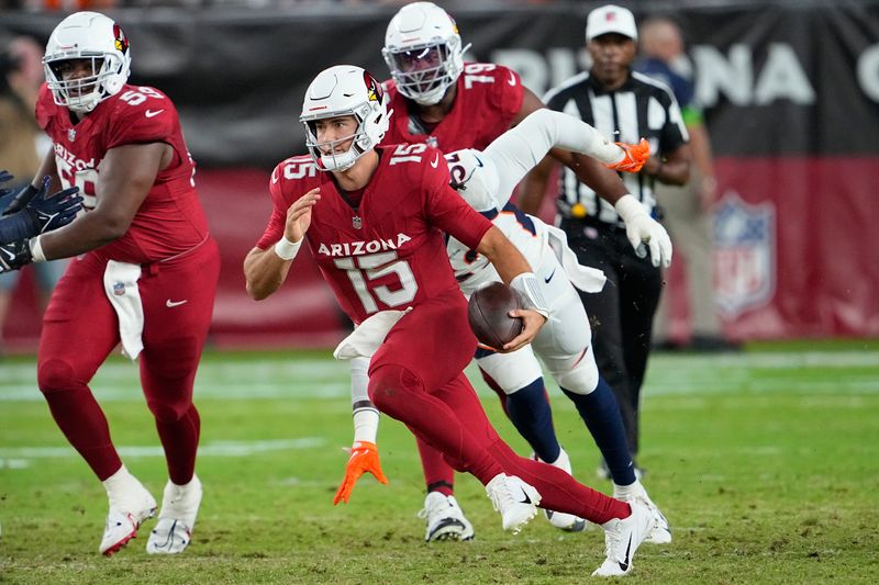 Arizona Cardinals quarterback Clayton Tune (15) runs against the Denver Broncos during the first half of an NFL preseason football game in Glendale, Ariz., Friday, Aug. 11, 2023. (AP Photo/Matt York)