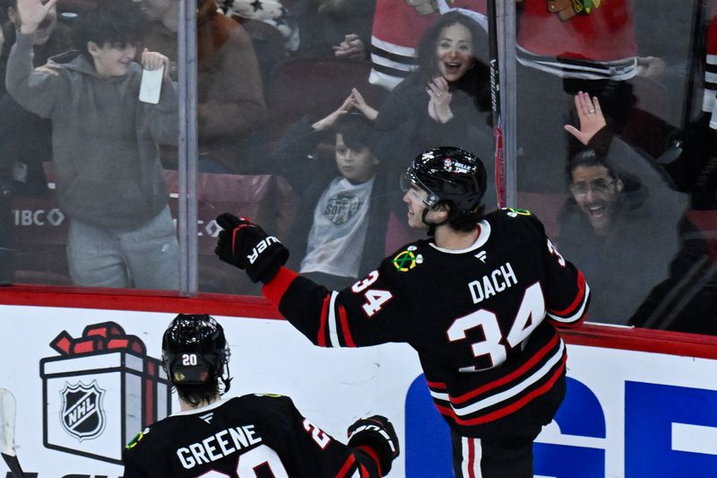 Nov 30, 2025; Chicago, Illinois, USA;  Chicago Blackhawks center Colton Dach (34) celebrates after scoring a goal against the Anaheim Ducks during the second period at United Center. Mandatory Credit: Matt Marton-Imagn Images