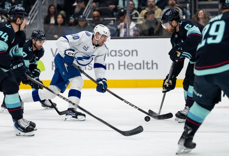 Mar 17, 2026; Seattle, Washington, USA; Tampa Bay Lightning defenseman J.J. Moser (90), middle, skates with the puck aginst Seattle Kraken defenseman Adam Larsson (6) during the first period at Climate Pledge Arena. Mandatory Credit: Stephen Brashear-Imagn Images Mar 17, 2026; Seattle, Washington, USA; Tampa Bay Lightning defenseman J.J. Moser (90), middle, skates with the puck aginst Seattle Kraken defenseman Adam Larsson (6) during the first period at Climate Pledge Arena. Mandatory Credit: Stephen Brashear-Imagn Images