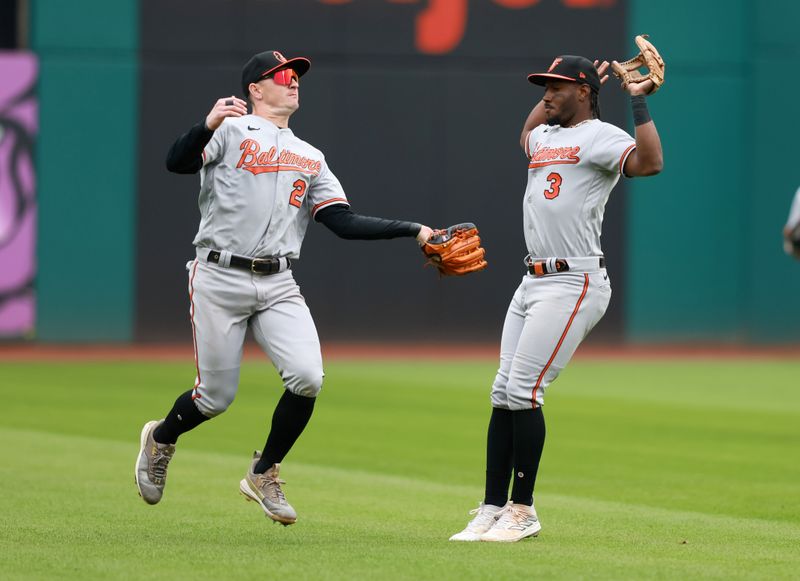 Sep 24, 2023; Cleveland, Ohio, USA; Baltimore Orioles left fielder Austin Hays  (21) makes a catch in front of shortstop Jorge Mateo (3) on a ball hit by Cleveland Guardians right fielder Will Brennan (17) during the seventh inning at Progressive Field. Mandatory Credit: Aaron Josefczyk-USA TODAY Sports