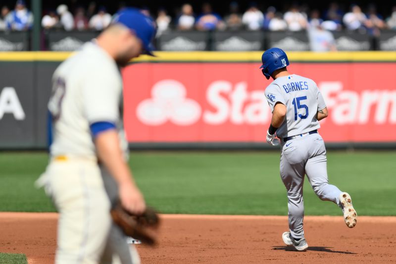 Sep 17, 2023; Seattle, Washington, USA; Los Angeles Dodgers catcher Austin Barnes (15) runs the bases after hitting a 2-run home run against the Seattle Mariners during the second inning at T-Mobile Park. Mandatory Credit: Steven Bisig-USA TODAY Sports