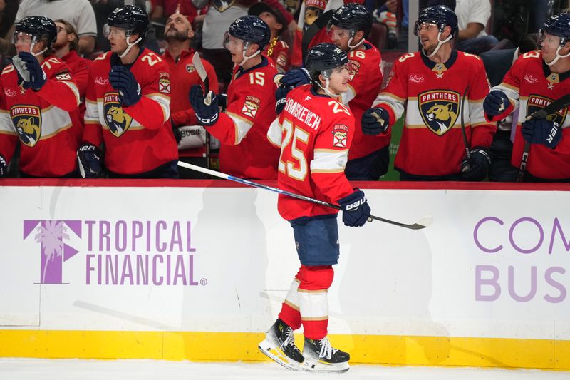 Nov 16, 2024; Sunrise, Florida, USA;  Florida Panthers right wing Mackie Samoskevich (25) celebrates after a goal against the Winnipeg Jets during the first period at Amerant Bank Arena. Mandatory Credit: Jim Rassol-Imagn Images