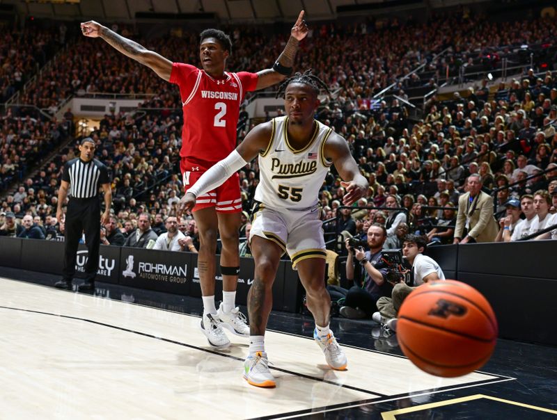 Mar 10, 2024; West Lafayette, Indiana, USA; Purdue Boilermakers guard Lance Jones (55) and Wisconsin Badgers guard AJ Storr (2) react to a ball that went out of bounds during the second half at Mackey Arena. Mandatory Credit: Marc Lebryk-USA TODAY Sports