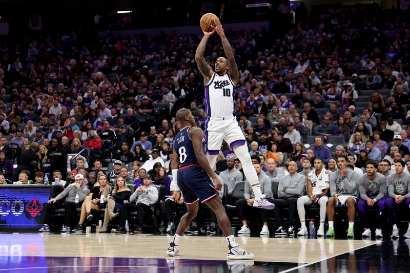 SACRAMENTO, CALIFORNIA - NOVEMBER 08: DeMar DeRozan #10 of the Sacramento Kings shoots over Kris Dunn #8 of the LA Clippers in the second half at Golden 1 Center on November 08, 2024 in Sacramento, California. NOTE TO USER: User expressly acknowledges and agrees that, by downloading and/or using this photograph, user is consenting to the terms and conditions of the Getty Images License Agreement.  (Photo by Ezra Shaw/Getty Images)