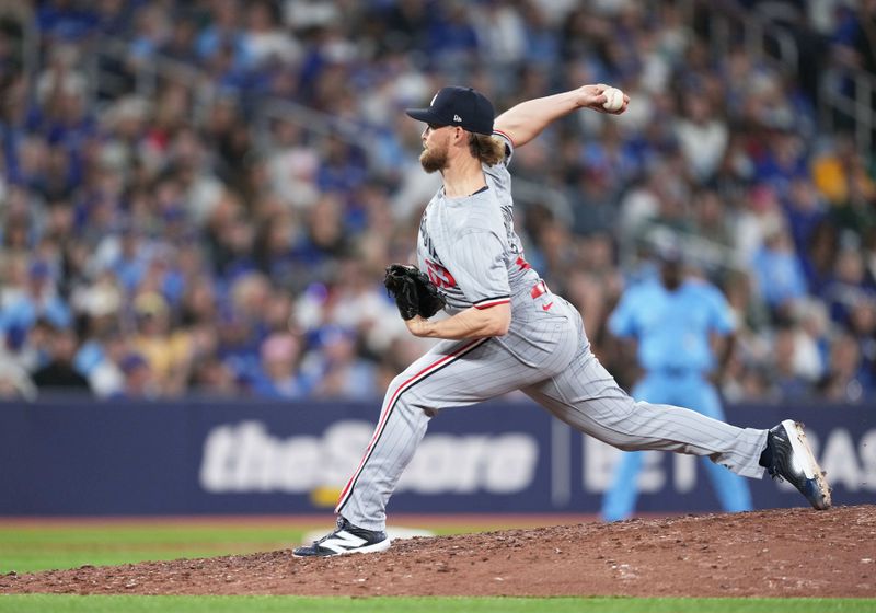 May 11, 2024; Toronto, Ontario, CAN; Minnesota Twins relief pitcher Josh Staumont (63) throws a pitch against the Toronto Blue Jays during the eighth inning at Rogers Centre. Mandatory Credit: Nick Turchiaro-USA TODAY Sports